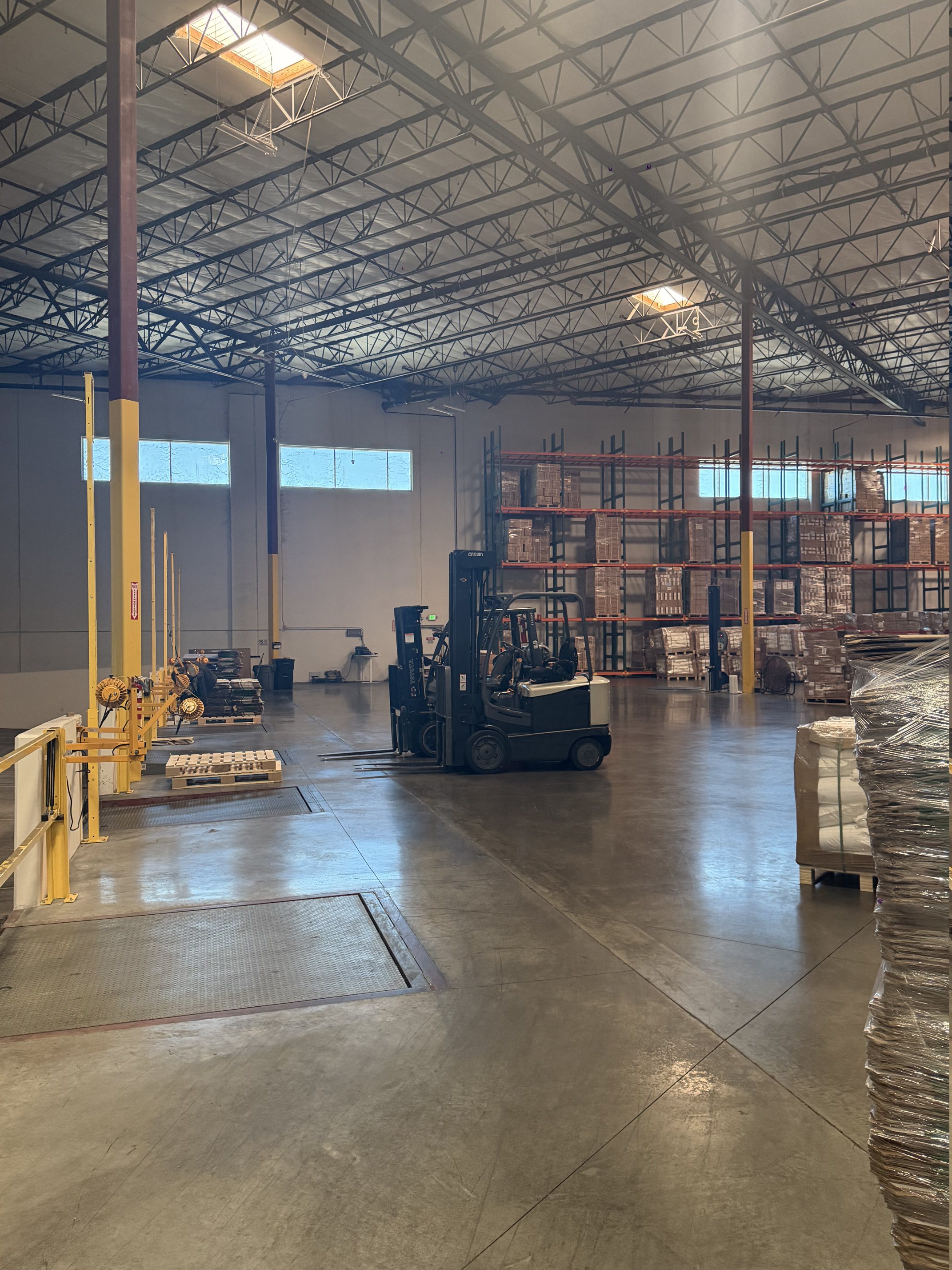 Forklift operating inside a Shany warehouse